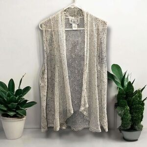 Two XL sleeveless vests. One cream lace and one black.